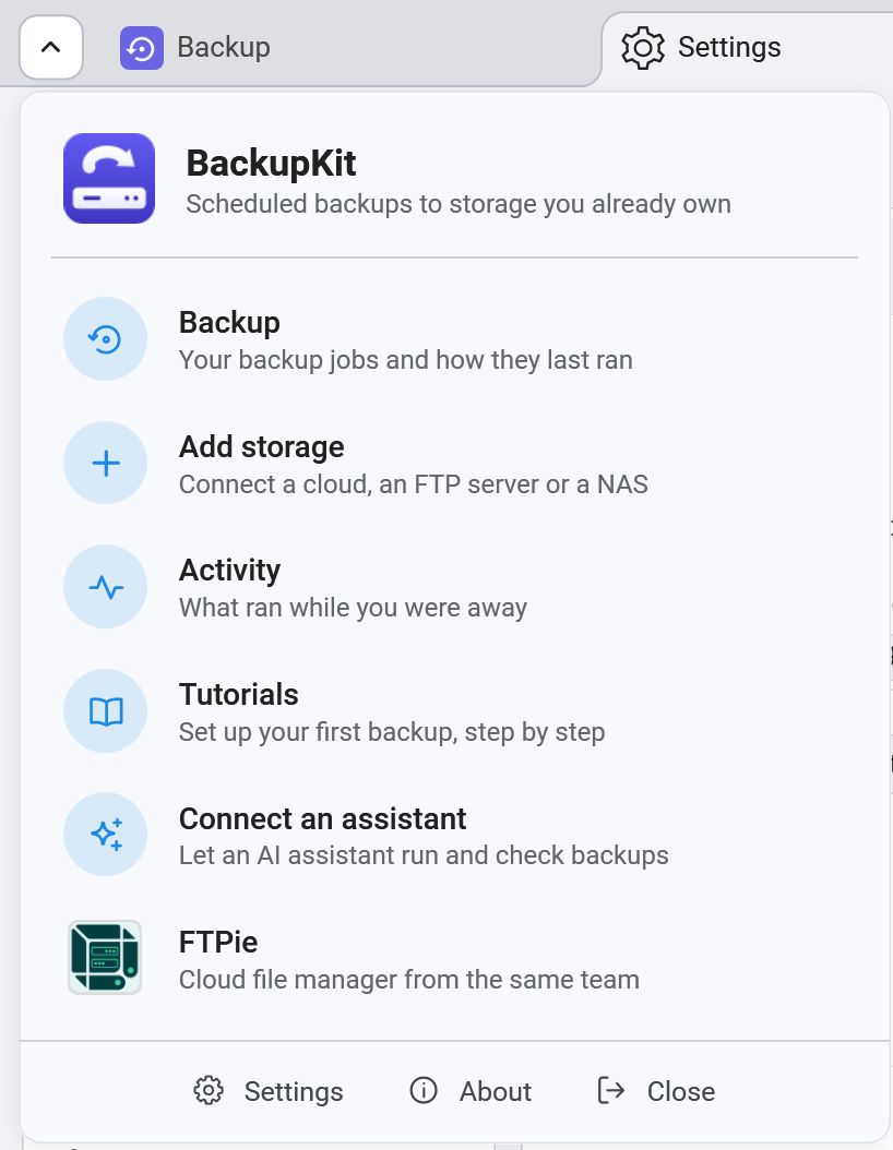 BackupKit's main menu open under the tabs: Backup, Add storage, Activity, Tutorials, Connect an assistant and FTPie, each with a one-line description, and Settings, About and Close along the bottom